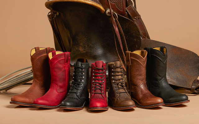 A group of Men’s and Women’s Justin Ropers in front of a saddle.