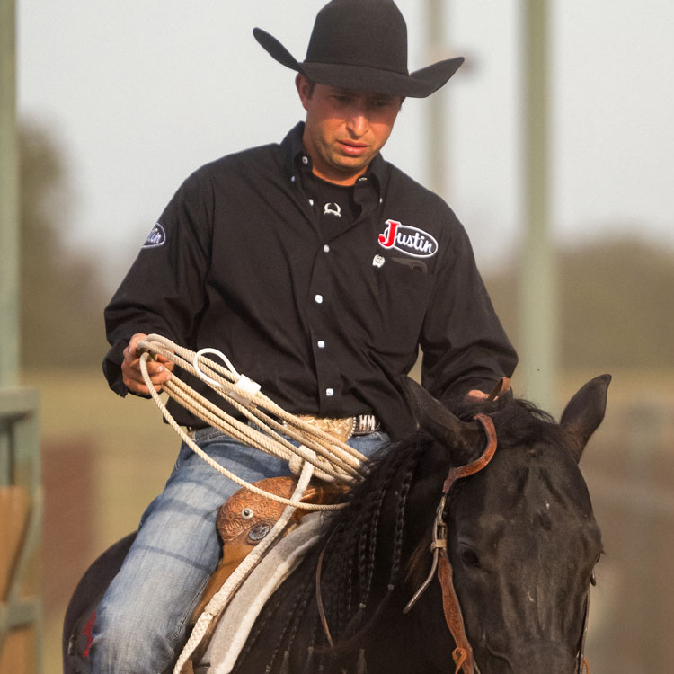 Haven Meged wearing a black hat while riding a horse.