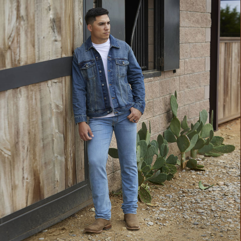 A man wearing the Justin Denim Jacket in blue.