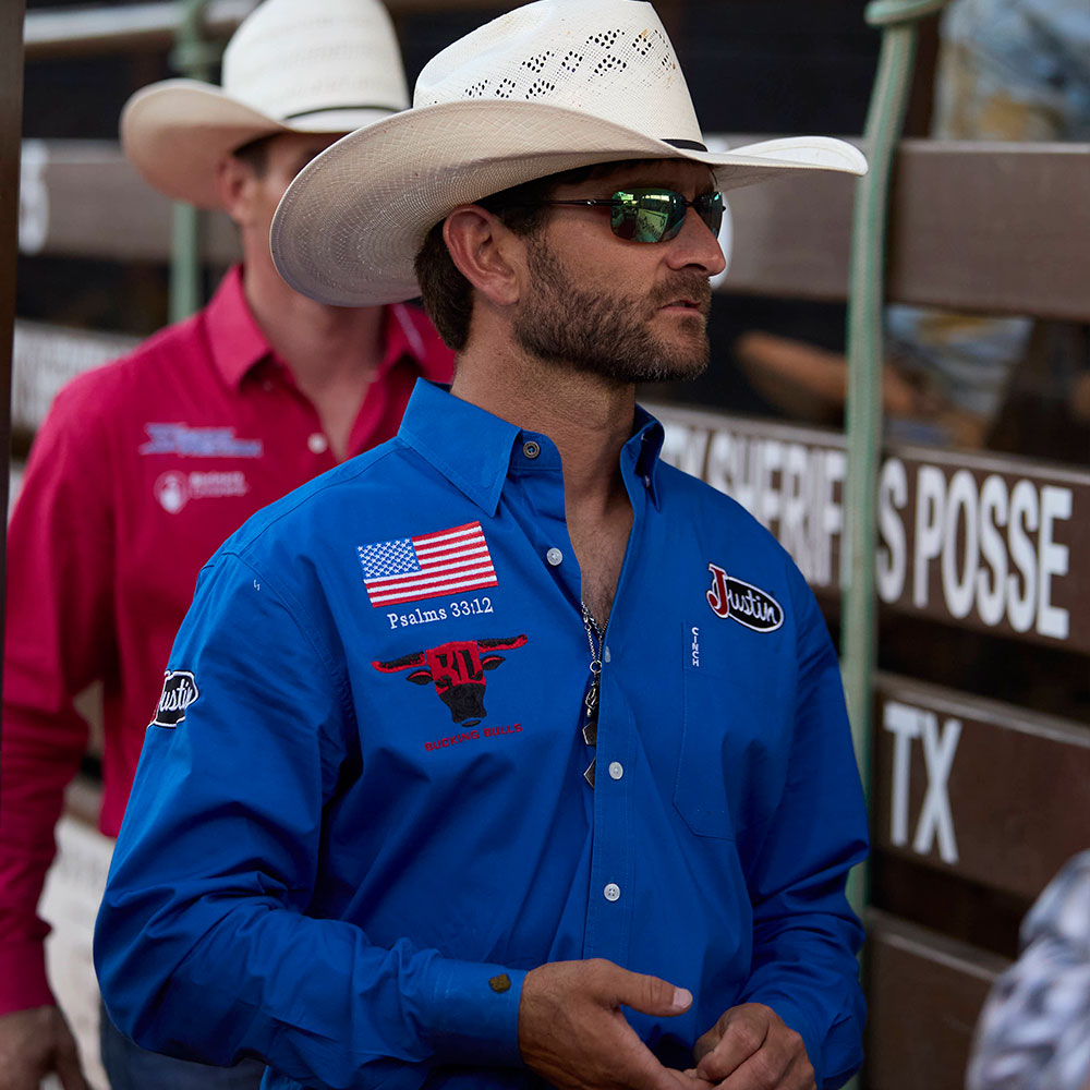 Dustin Boquet wearing a straw hat and a blue.