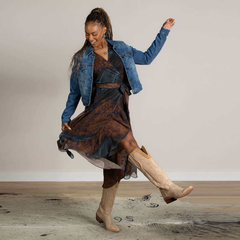 A woman wearing the Justin Wrap Maxi Dress in  Multicolor (brown).