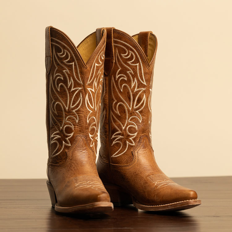 Women’s Josephine 12” Western boot in dusky brown on a wooden floor