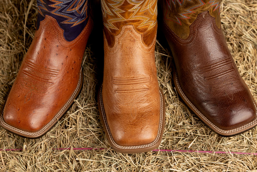 A close up of Justin square-toe boots.