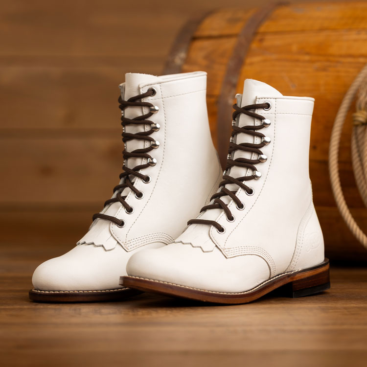 McKean 7-inch lace-up roper boots in vintage white. Shop McKean