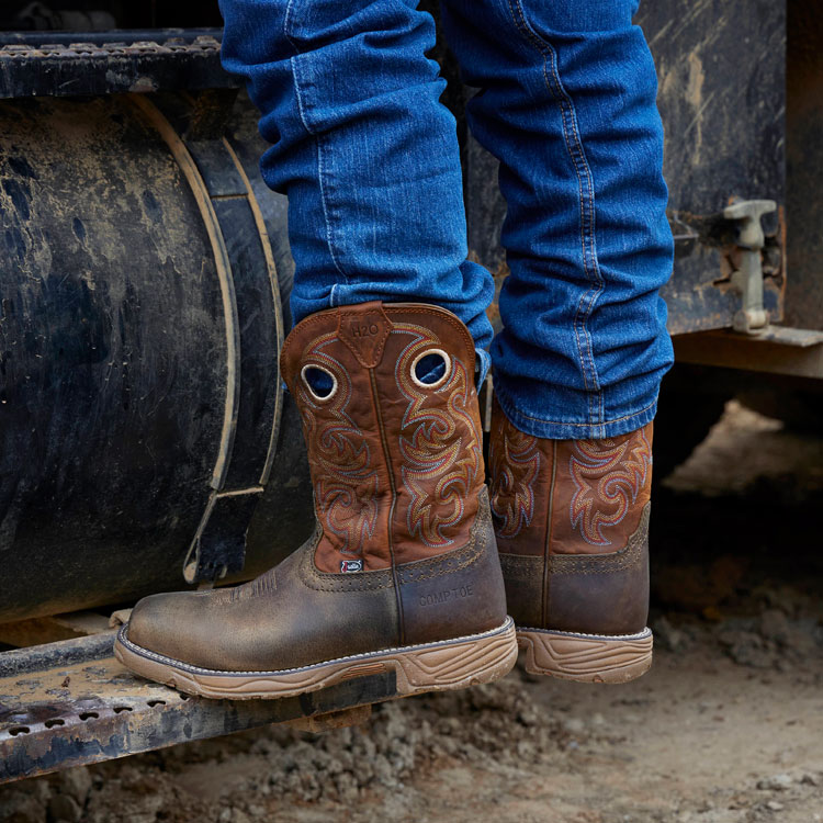 A man wearing Rush 11 inch Waterproof Comp Toe Boot in Peanut Tan. Shop the Rush 11 inch Waterproof Comp Toe Boot.