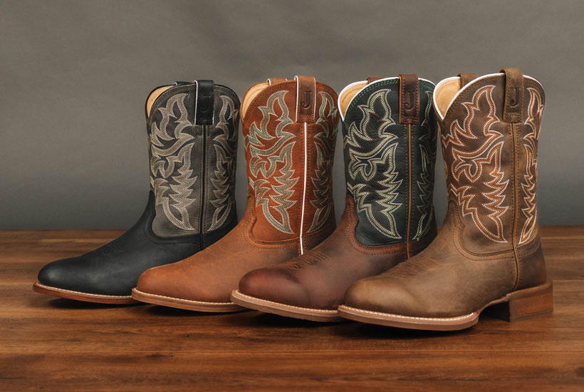 Men’s Justin Wild Bill 11” Western boots in brown, Men’s Justin Wild Bill 11” Western boots in tan, Justin Men’s Disco Man 11” Western boots in Brown,  and Justin Men’s Disco Man 11” Western boots in black posed on a wood floor.