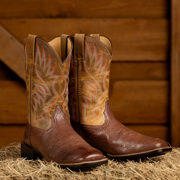 Conroe 11-inch smooth ostrich boots in kango tobac (brown). Shop Conroe.
