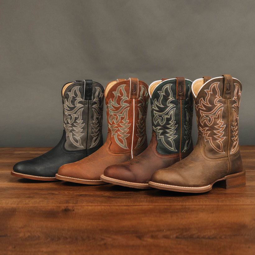 Men’s Justin Wild Bill 11” Western boots in brown, Men’s Justin Wild Bill 11” Western boots in tan, Justin Men’s Disco Man 11” Western boots in Brown,  and Justin Men’s Disco Man 11” Western boots in black posed on a wood floor.