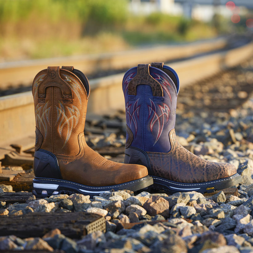 Men’s Frontline HiViz 11” Waterproof Nano Comp Toe in brown posed by a railroad track.